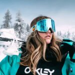 Woman hiker wearing outdoor gear on a forest trail — hiking and adventure lifestyle.